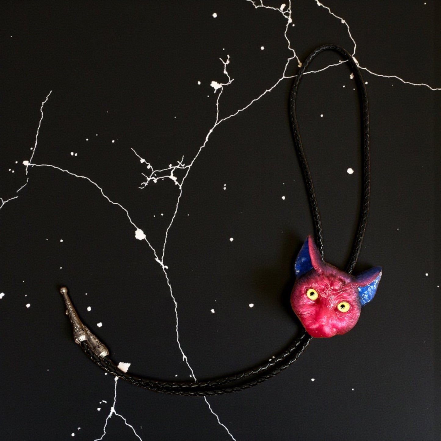 Cat bolo tie in pink and blue.