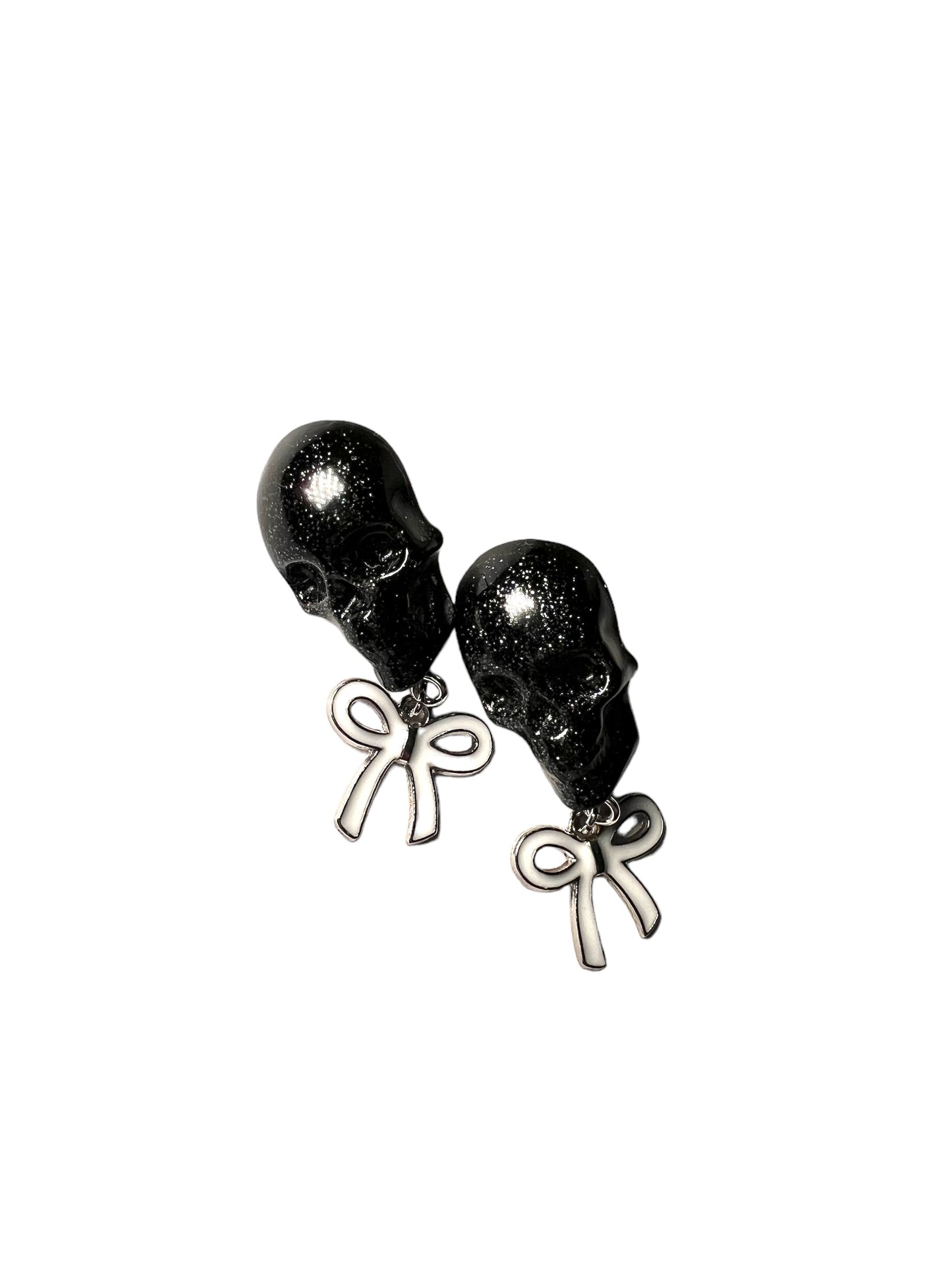 Skull with white bow and silver metal earrings studs