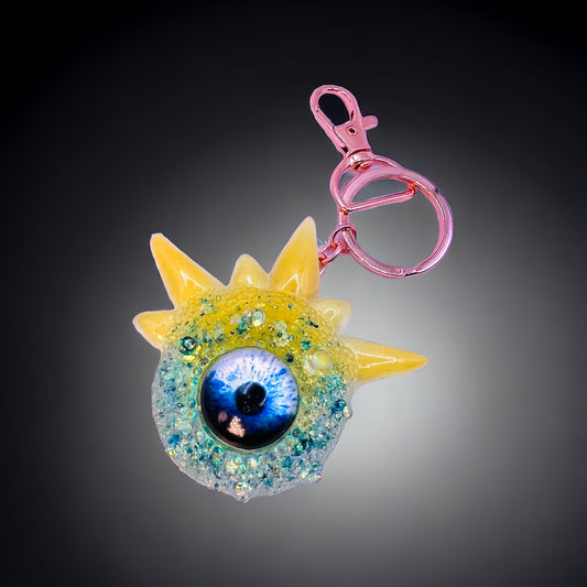 Cute Monster Eye keychain, yellow and blue. Model Spiky.