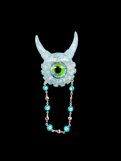 09/05 Monster brooch with chain. Model Vicky.