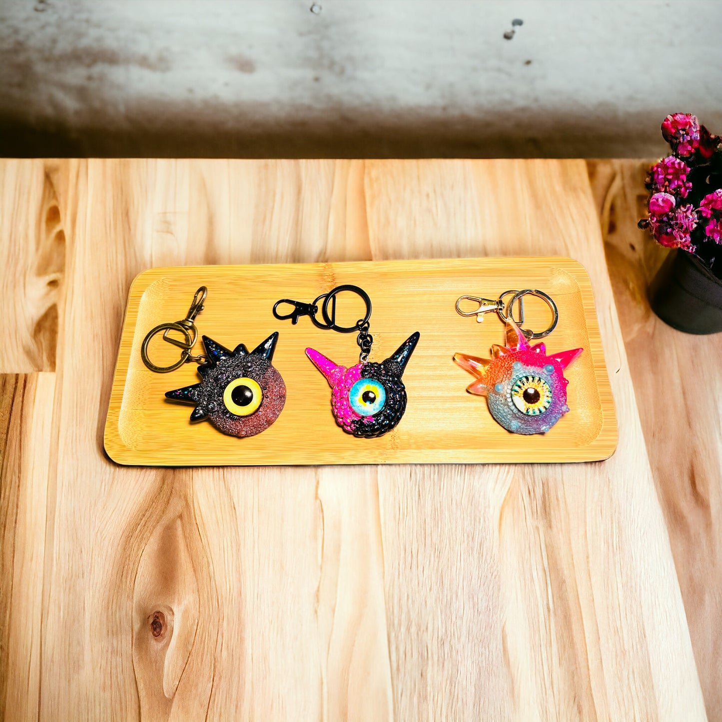 Creepy Monster Eye keychain, black and copper. Model Spiky.