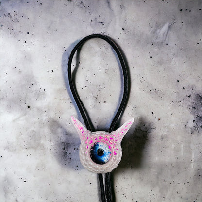 Monster bolo tie in white and pink. Model Pointy.