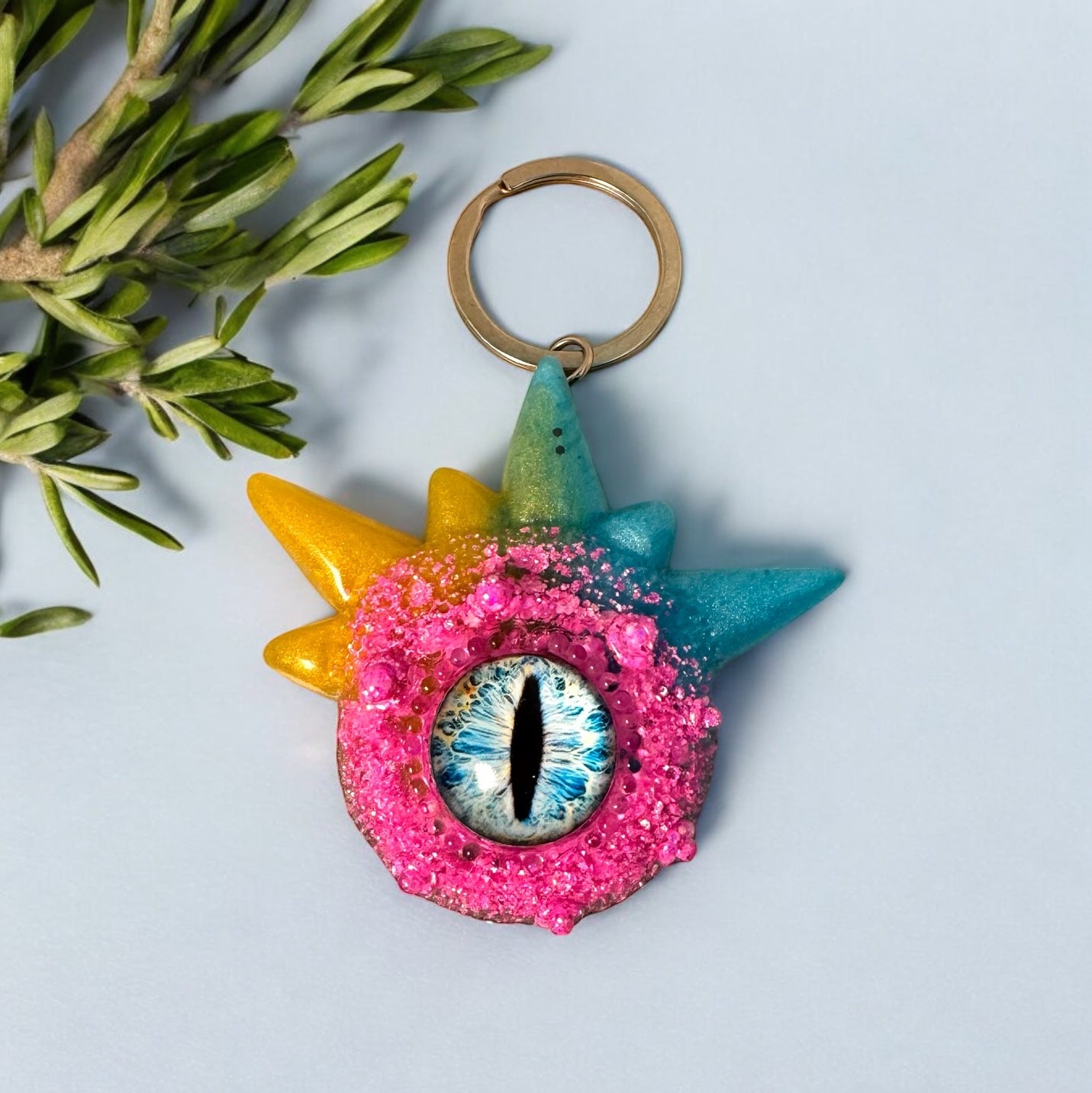 Monster keychain, pink,blue and yellow. Model Spiky.