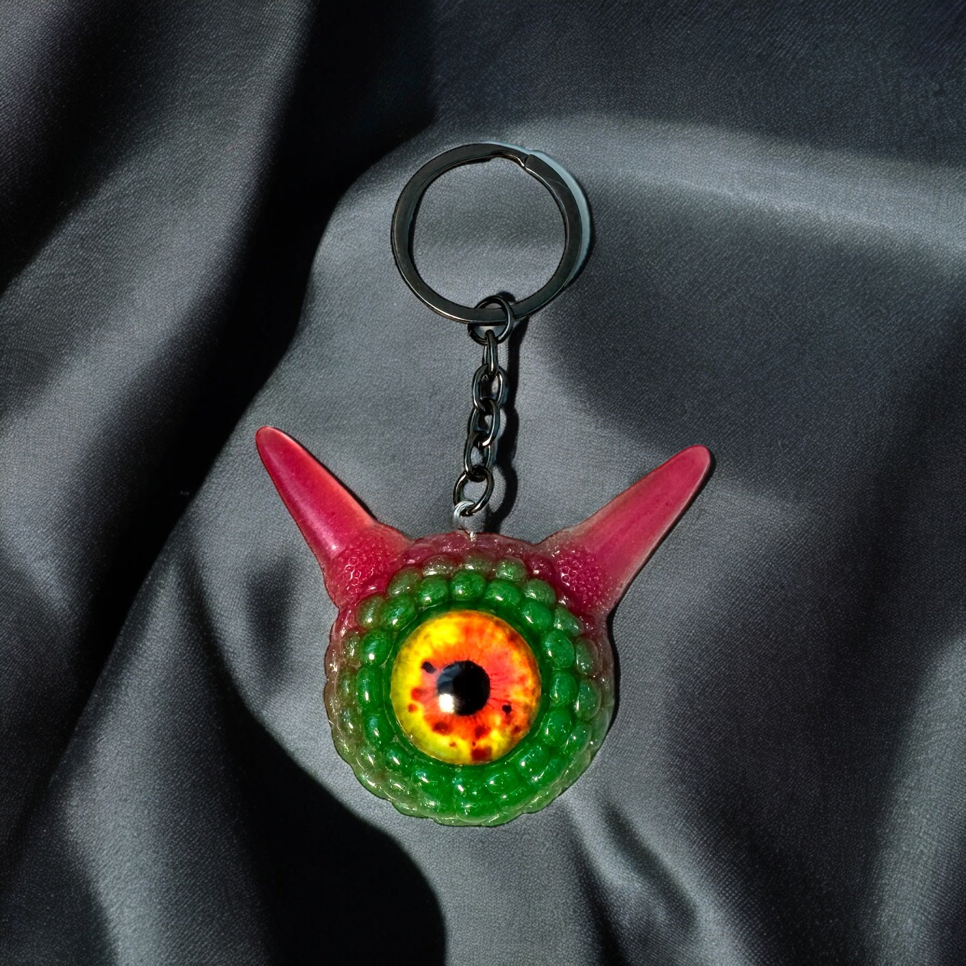 Monster green and pink kawaii keychain. Model Pointy.