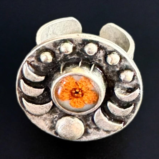 Moon phase ring with orange flower