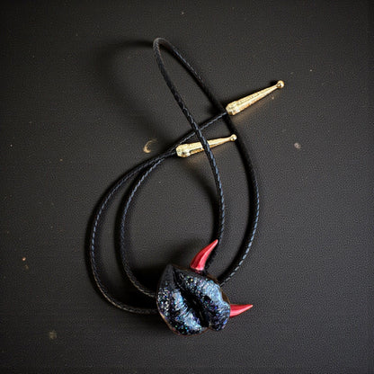 Bolo tie with red horns, shiny black lips