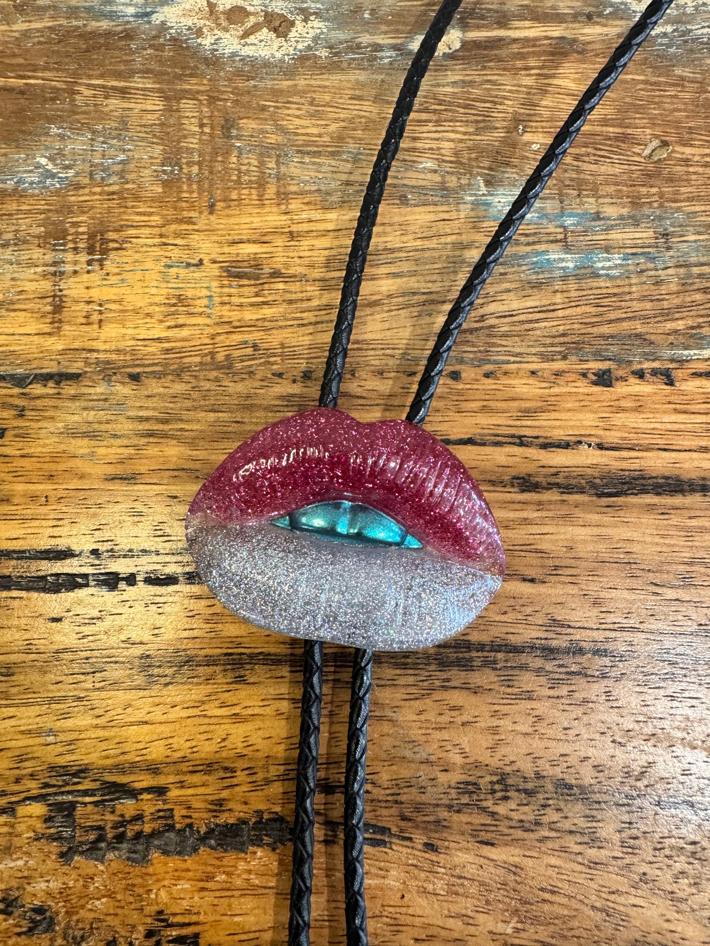 Bolo tie, silver and pink lips with blue teeth