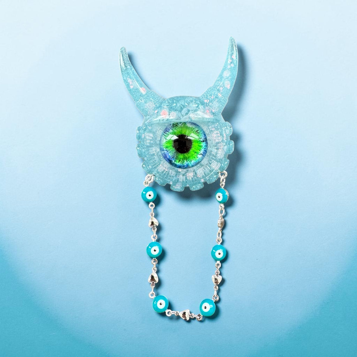 09/05 Monster brooch with chain. Model Vicky.