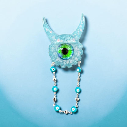 09/05 Monster brooch with chain. Model Vicky.