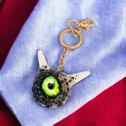 Monster black and gold kawaii keychain. Model Pointy.