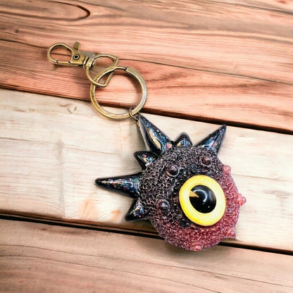 Creepy Monster Eye keychain, black and copper. Model Spiky.