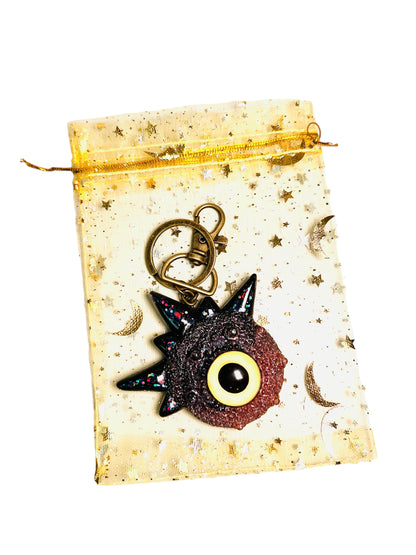 Creepy Monster Eye keychain, black and copper. Model Spiky.