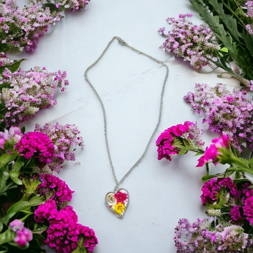 Heart necklace with pink and yellow flowers and watch part