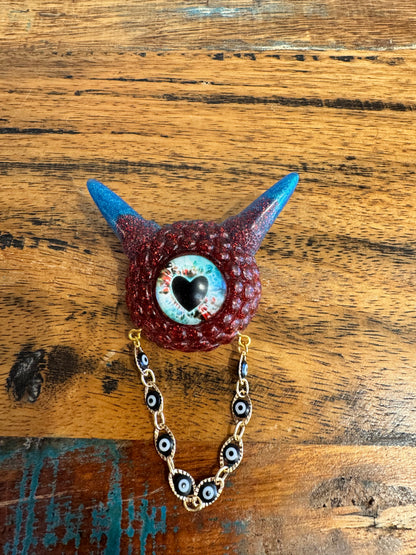 Monster brooch in red and blue. Model Pointy.