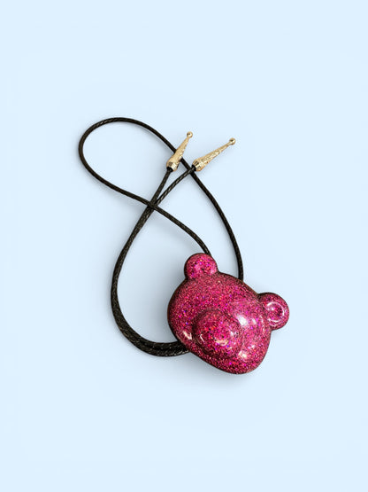 Gummy bear head bolo tie in pink and black.