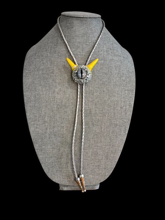 Monster bolo tie in silver and yellow. Model Pointy.