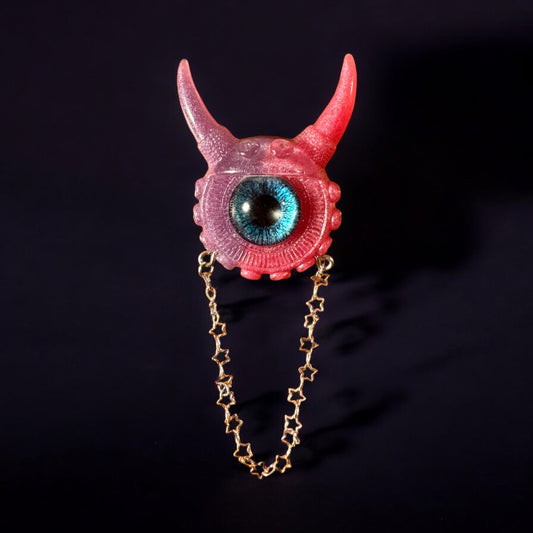 Monster brooch, edgy pink and purple pastel goth brooch in resin, weird and unique eye jewelry. Model Vicky.