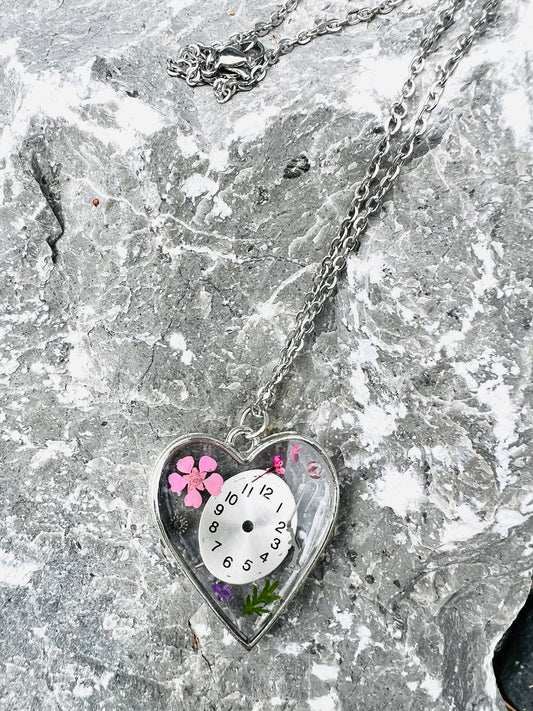 Heart necklace with pink flowers and watch face and gear