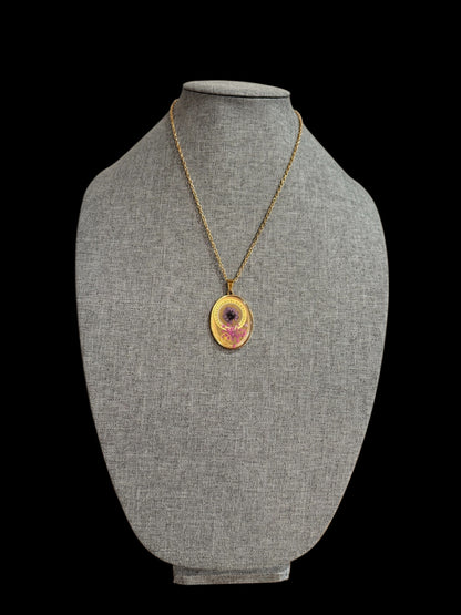 Oval necklace with purple and pink flowers and watch parts