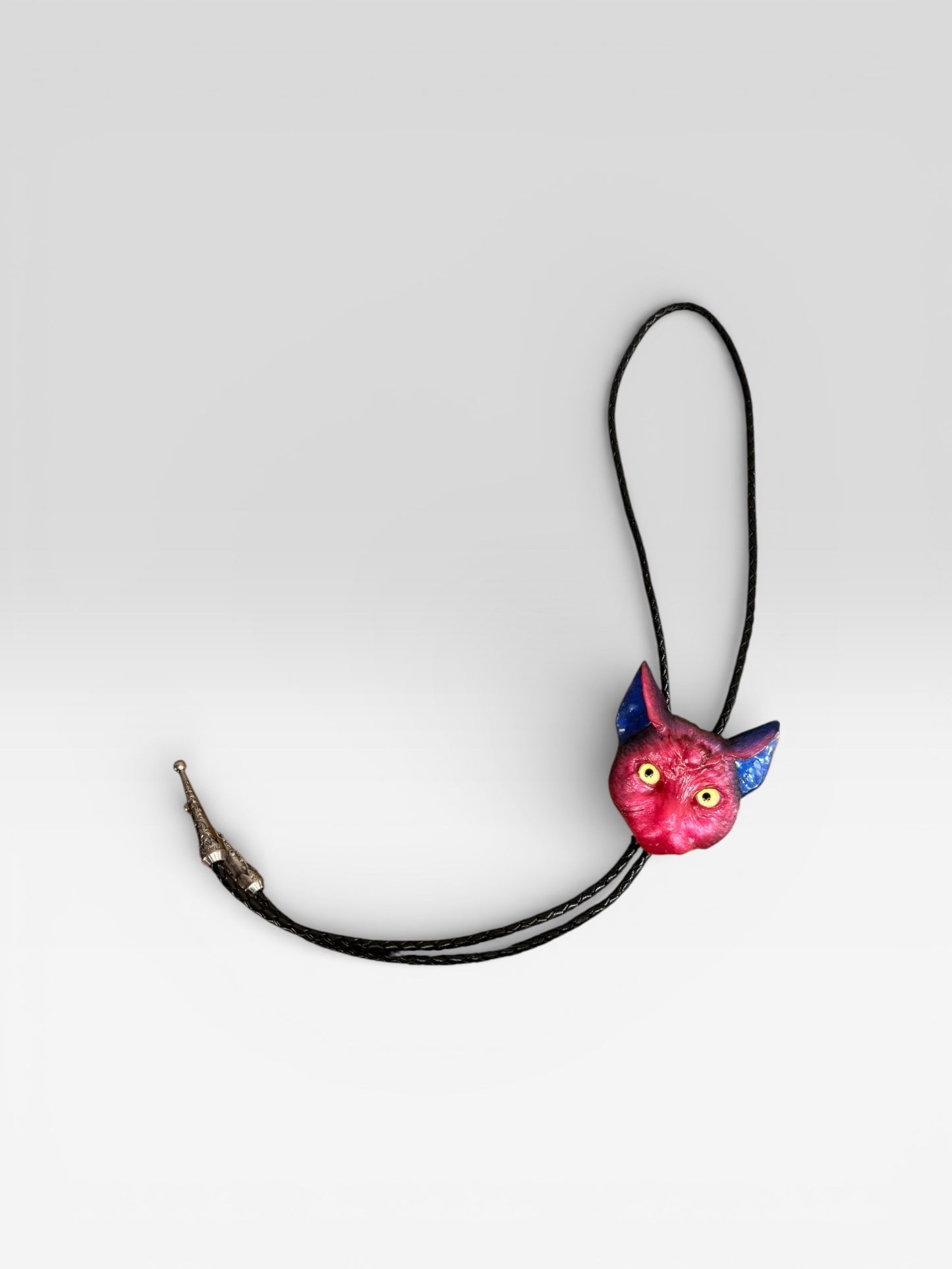 Cat bolo tie in pink and blue.