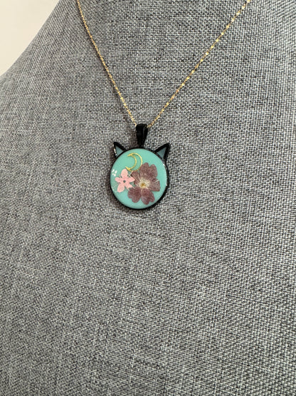 Cat head necklace with pink and purple flowers and moon