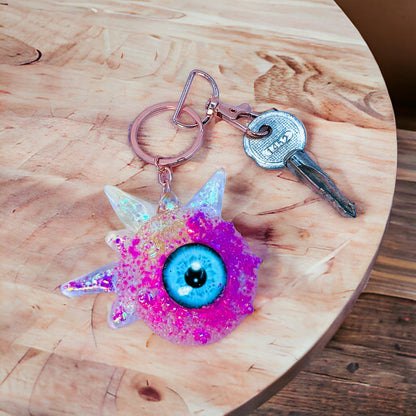 Pink glitter monster keychain. Model Spiky.