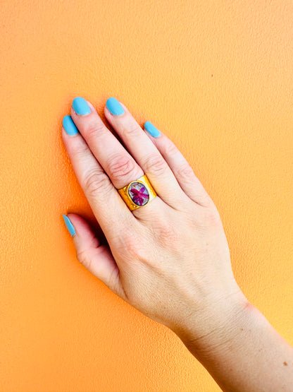 Circular gold plated ring with pink flower and star
