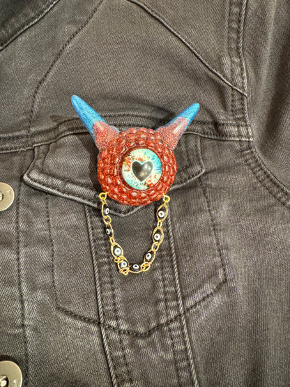 Monster brooch in red and blue. Model Pointy.