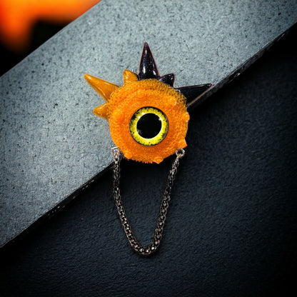 Handmade brooch, orange and black monster brooch, pastel goth jewelry, evil eye brooch in resin,creepy cute,spooky jewelry, kawaii brooch, unique brooch. Model Spiky.