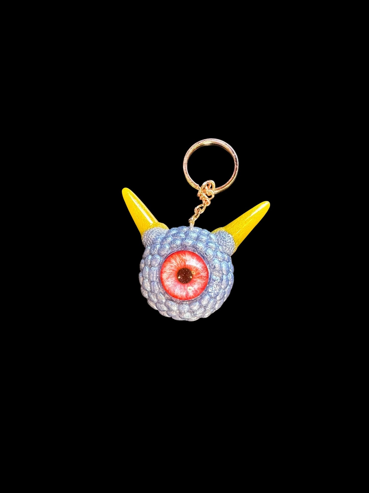 Monster grey purple and yellow keychain. Model Pointy.