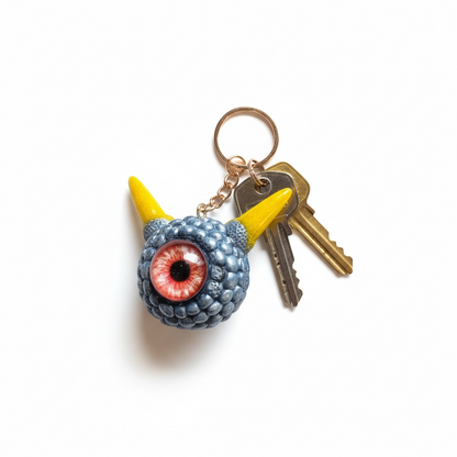 Monster grey purple and yellow keychain. Model Pointy.