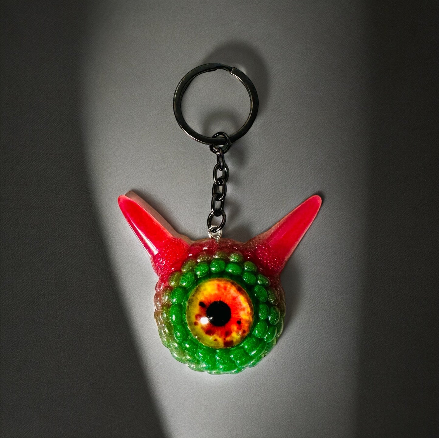 Monster green and pink kawaii keychain. Model Pointy.