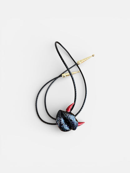 Bolo tie with red horns, shiny black lips