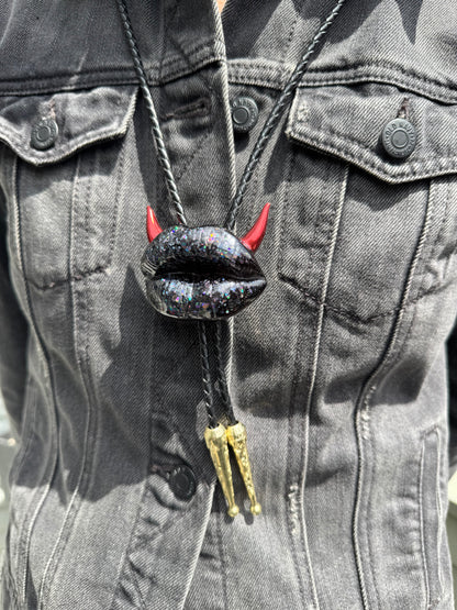 Bolo tie with red horns, shiny black lips