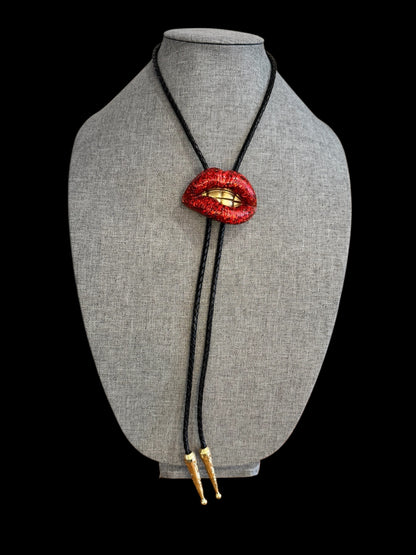 Bolo tie, sparkly red lips with gold teeth