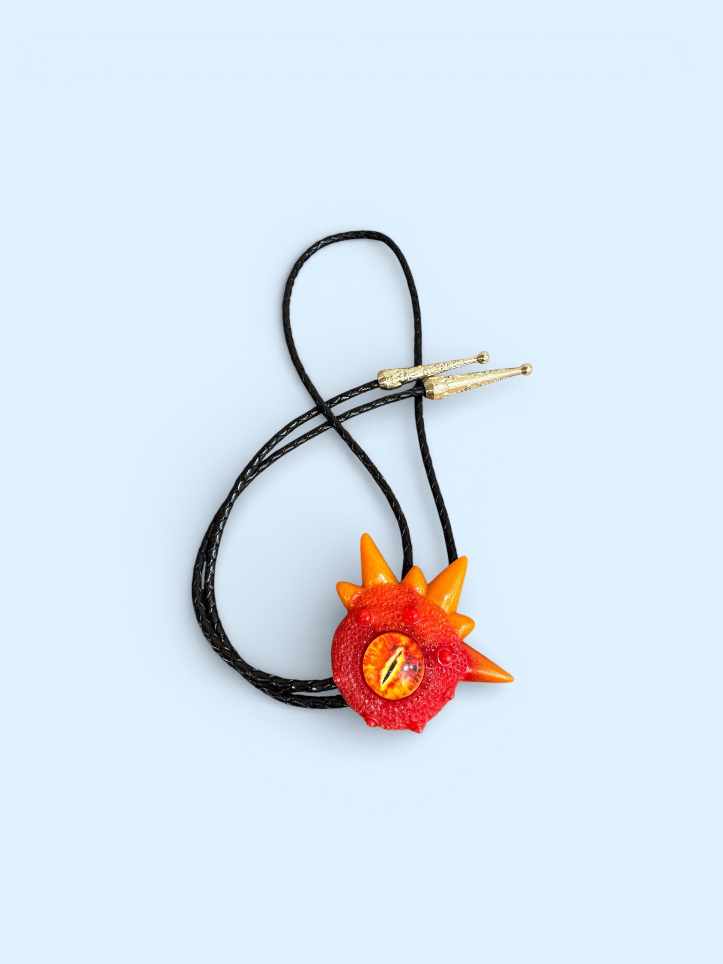 Monster bolo tie in red and orange. Model Spiky.
