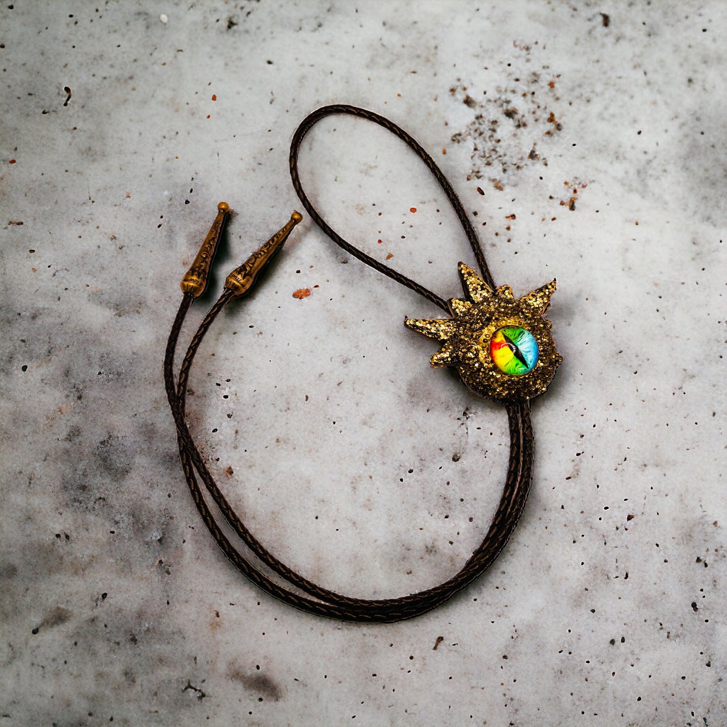 Bolo tie, black and gold monster bolo necktie. Model Spiky.