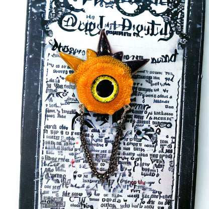 Handmade brooch, orange and black monster brooch, pastel goth jewelry, evil eye brooch in resin,creepy cute,spooky jewelry, kawaii brooch, unique brooch. Model Spiky.