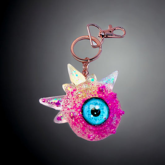 Pink glitter monster keychain. Model Spiky.
