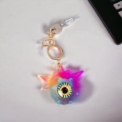 Monster keychain, pink,blue and yellow. Model Spiky.