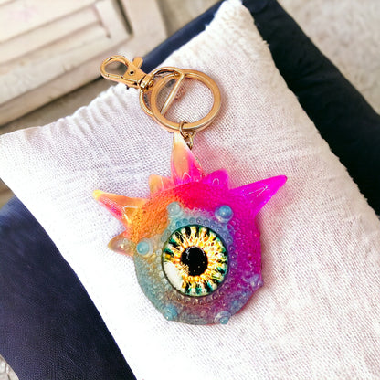 Monster keychain, pink,blue and yellow. Model Spiky.