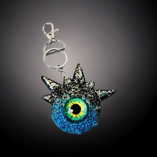 Blue glitter monster keychain. Model Spiky.