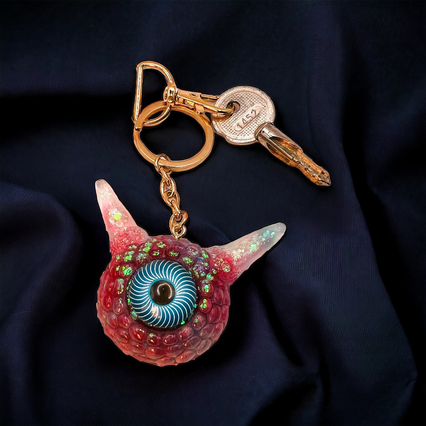 Monster Eye red and blue keychain. Model Pointy.