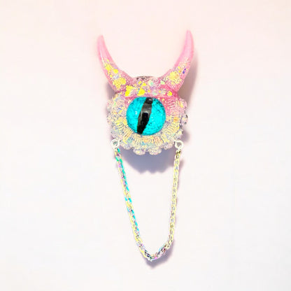 Handmade brooch, monster brooch in silver/pink glitter, pastel goth jewelry. Model Vicky.