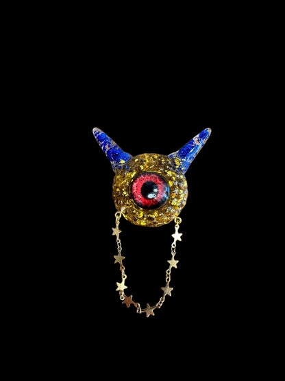 Monster brooch in gold and blue. Model Pointy.
