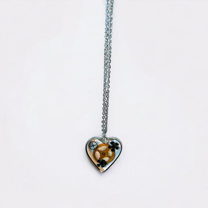 Heart necklace with black flowers and watch parts