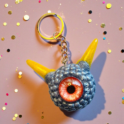 Monster grey purple and yellow keychain. Model Pointy.