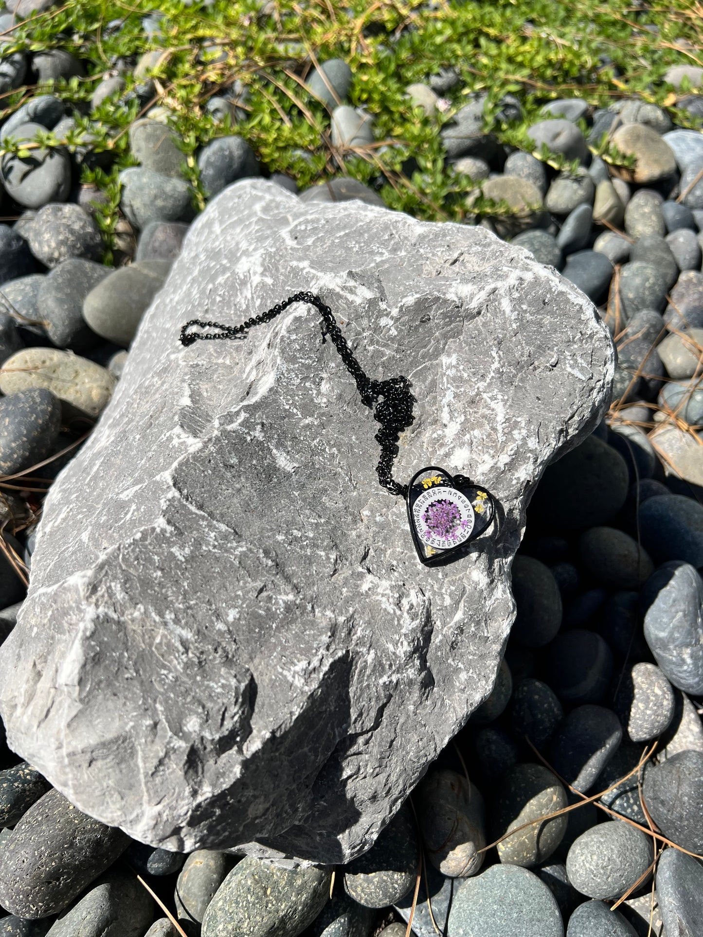 Black Heart necklace with purple and yellow Queen Anne lace flowers and watch part