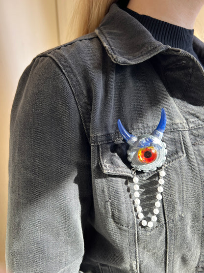 Blue and silver monster brooch. Model Vicky.