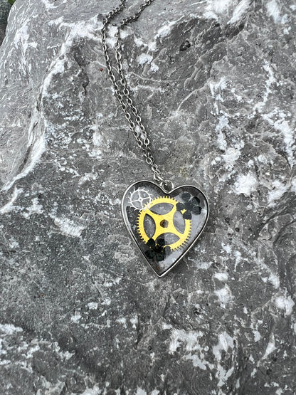 Heart necklace with black flowers and watch parts